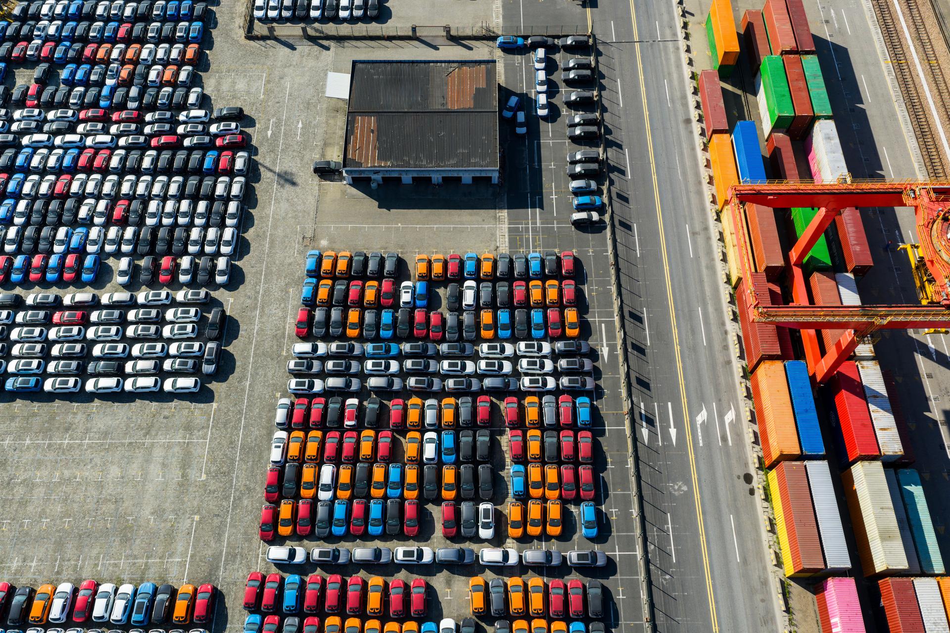 Aerial view new cars lined up in the port for import and export